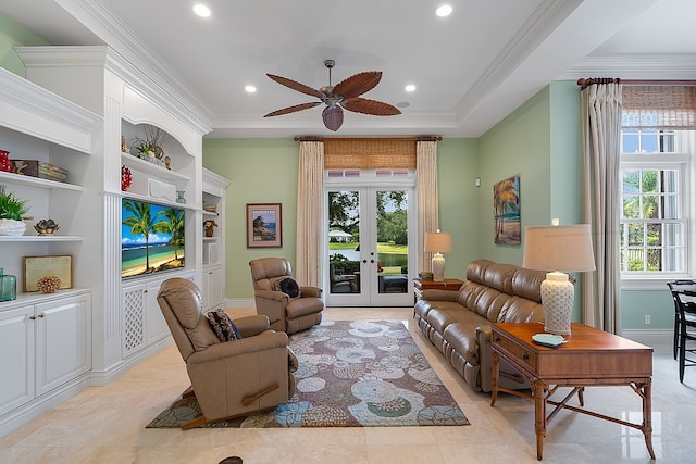 living room featuring ceiling fan, french doors, light tile patterned flooring, and ornamental molding