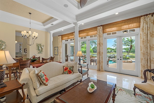 living room with a chandelier, french doors, ornate columns, and ornamental molding