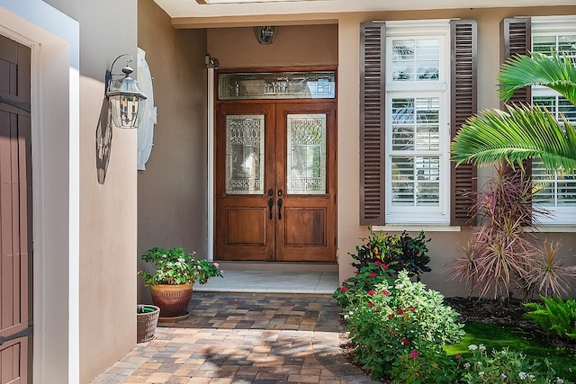 view of exterior entry featuring french doors