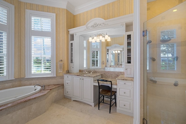 bathroom featuring a wealth of natural light, vanity, independent shower and bath, and ornamental molding