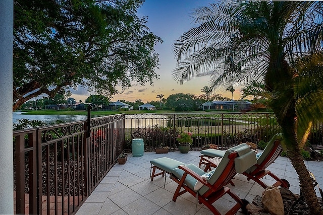 patio terrace at dusk with a water view