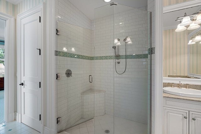 bathroom featuring tile patterned floors, vanity, and an enclosed shower