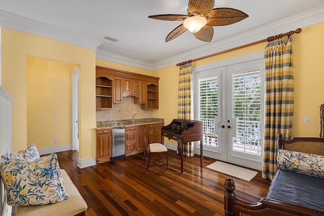 kitchen featuring dark wood-type flooring, french doors, ceiling fan, ornamental molding, and light stone counters