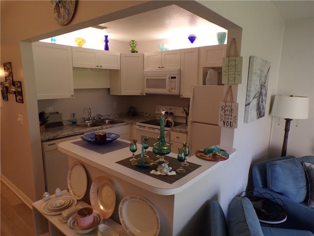 kitchen with a sink and white appliances