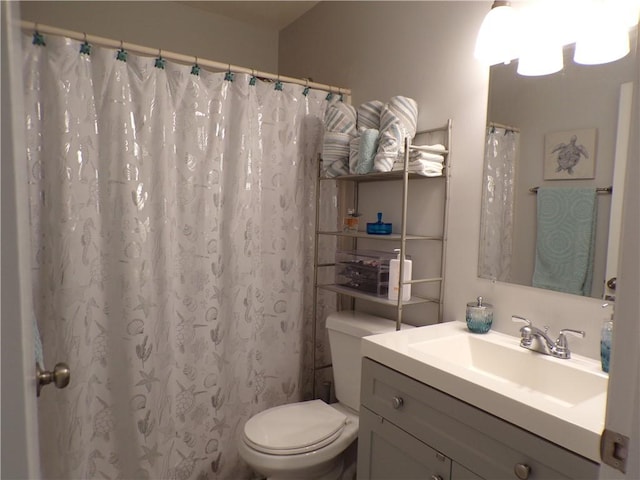 full bath featuring vanity and toilet