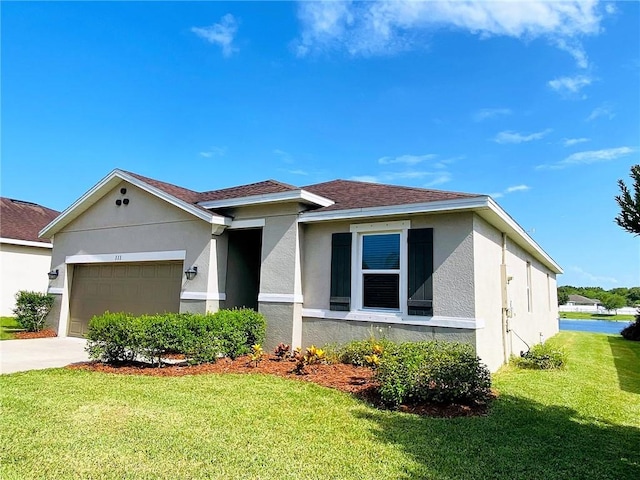 view of front facade featuring a garage and a front yard