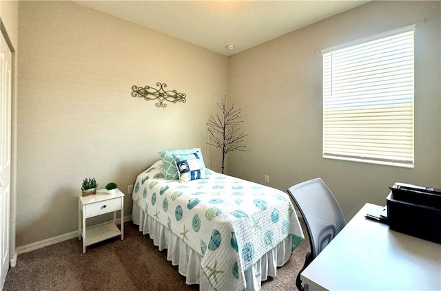 bedroom featuring dark carpet