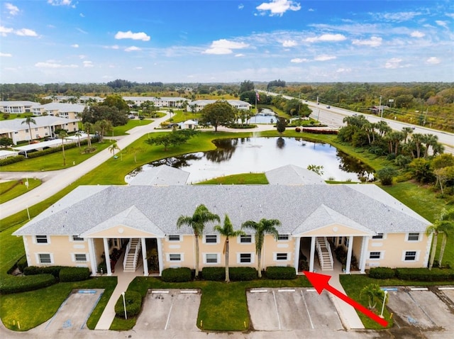 drone / aerial view with a water view