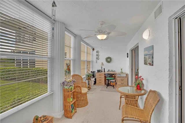 sunroom with ceiling fan