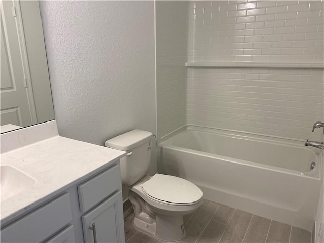 full bathroom with vanity, bathtub / shower combination, and toilet