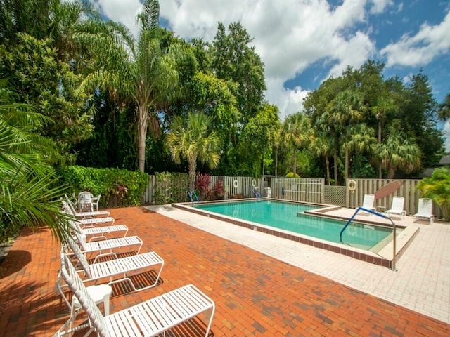 view of swimming pool with a patio area