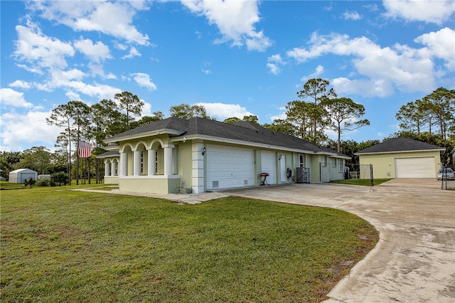 view of front of home featuring a garage and a front lawn