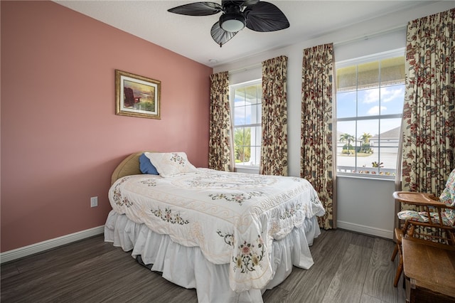 bedroom featuring dark hardwood / wood-style floors and ceiling fan