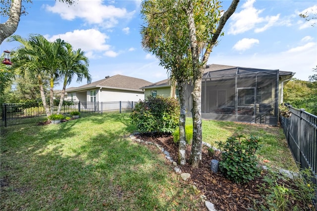 view of yard featuring glass enclosure