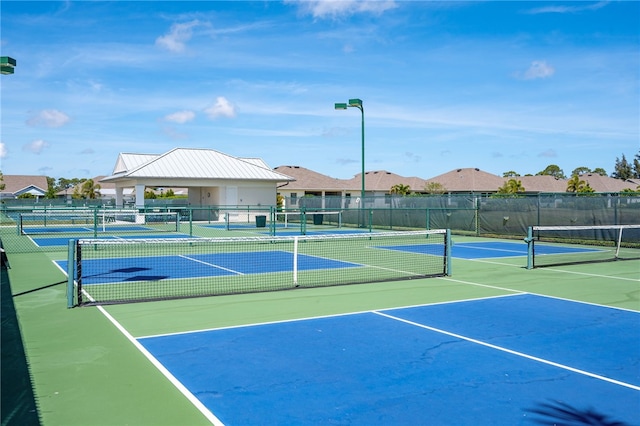 view of tennis court with a gazebo and basketball court