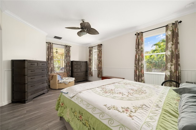 bedroom featuring wood-type flooring, ceiling fan, and ornamental molding