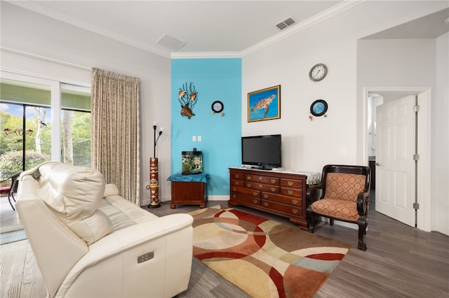 living room with crown molding and dark wood-type flooring