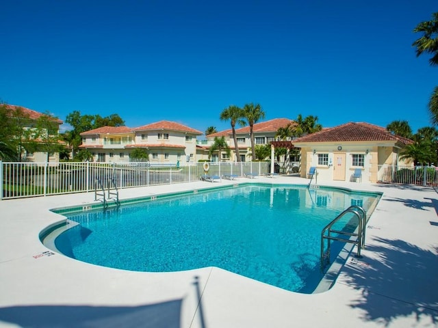 view of swimming pool with a patio