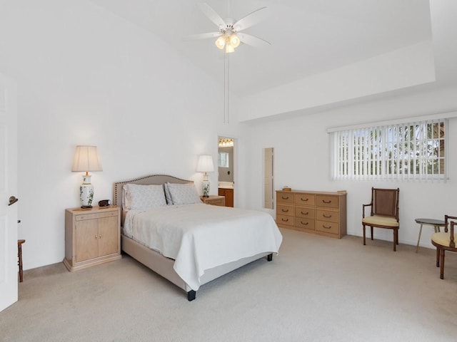 carpeted bedroom featuring ceiling fan and vaulted ceiling