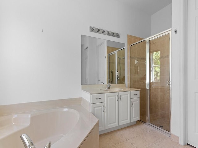 bathroom with tile patterned floors, vanity, and plus walk in shower