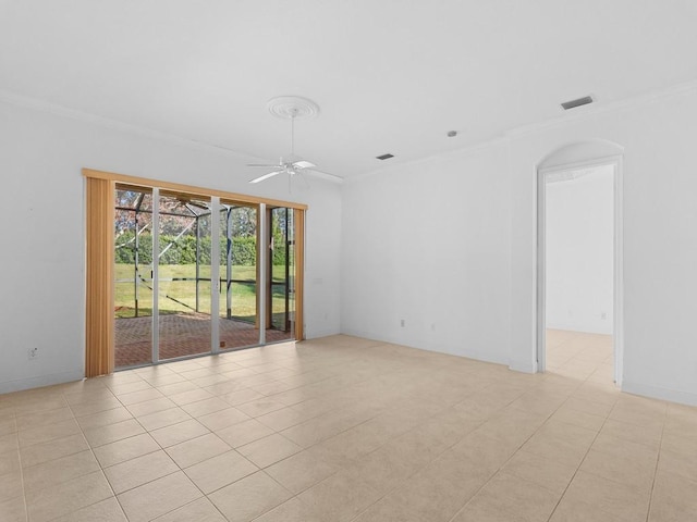 tiled spare room with ceiling fan and ornamental molding