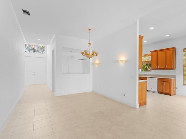 unfurnished living room with an inviting chandelier and ornamental molding