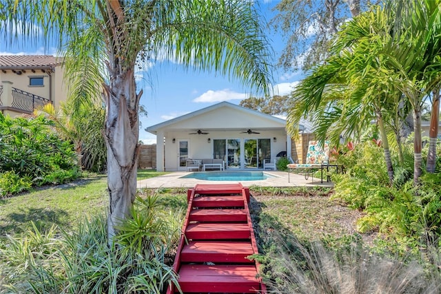 rear view of house featuring a patio area and ceiling fan