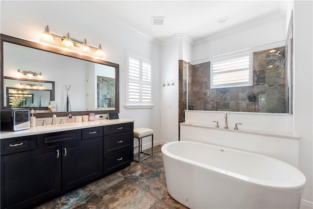 bathroom featuring ornamental molding, vanity, and independent shower and bath