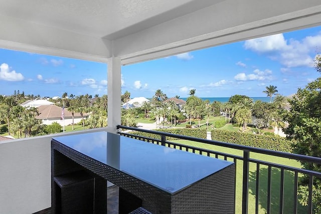 balcony featuring a water view