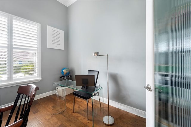 home office with dark hardwood / wood-style floors