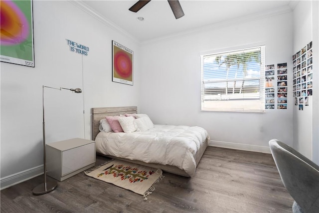 bedroom with hardwood / wood-style flooring, ceiling fan, and ornamental molding