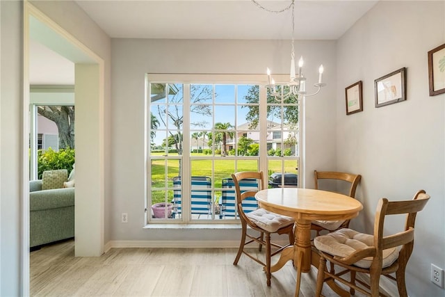 dining space featuring a notable chandelier