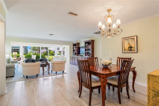 dining space featuring a notable chandelier and ornamental molding