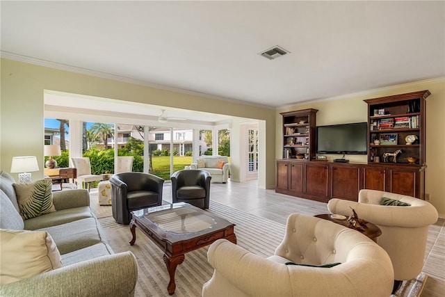 living room featuring crown molding and light tile patterned floors