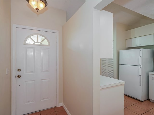 entryway with light tile patterned floors