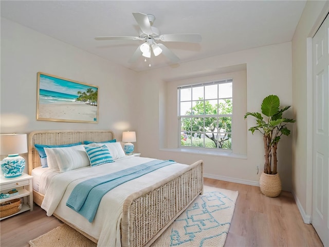 bedroom featuring light wood-type flooring and ceiling fan