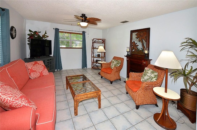 10320 92nd St, Vero Beach, FL 32967 - living area featuring a textured ceiling, visible vents, ceiling fan, and light tile patterned flooring