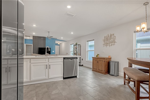 kitchen with ceiling fan with notable chandelier, sink, decorative light fixtures, dishwasher, and white cabinets