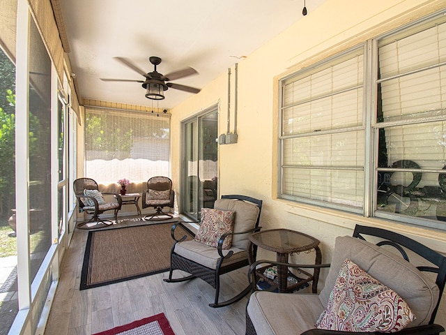 sunroom / solarium with ceiling fan