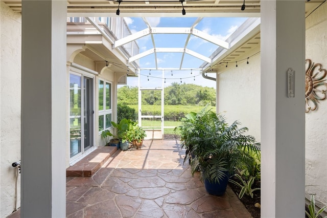 view of patio / terrace with a lanai