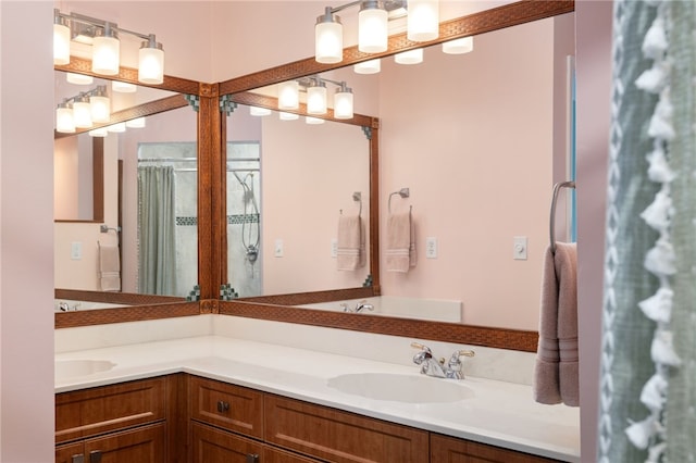 bathroom with a shower with shower curtain and vanity