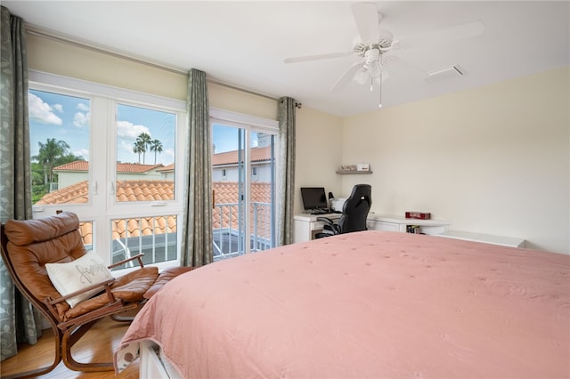 bedroom featuring hardwood / wood-style floors and ceiling fan