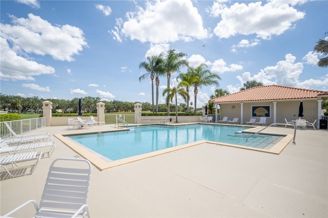 view of swimming pool with a patio