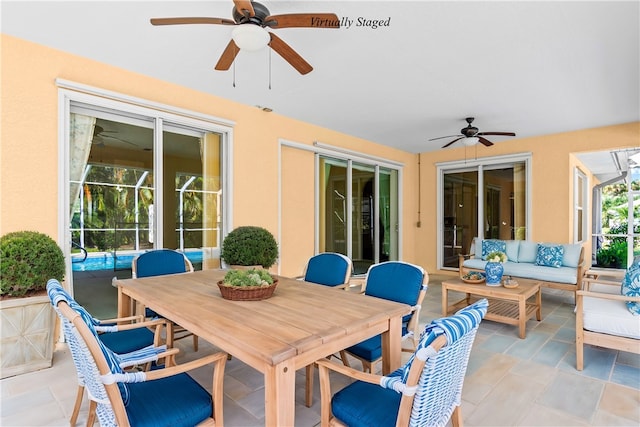 view of patio / terrace featuring ceiling fan and an outdoor living space