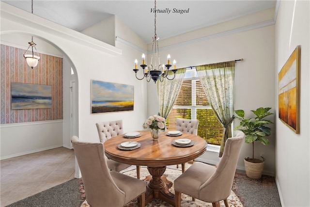 dining space with light tile patterned flooring, crown molding, vaulted ceiling, and an inviting chandelier