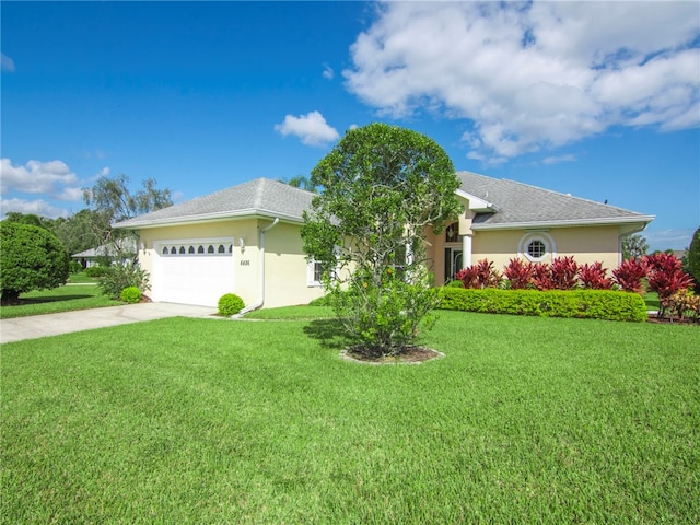 view of front of house featuring a garage and a front yard