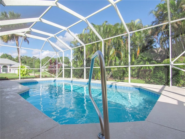 view of pool featuring a patio area and a lanai