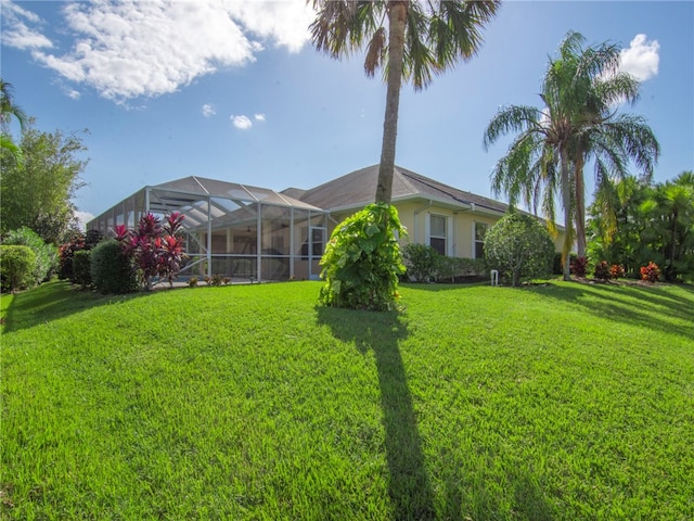 view of yard with a lanai