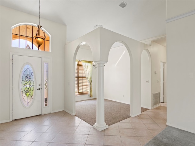 tiled entryway featuring ornate columns