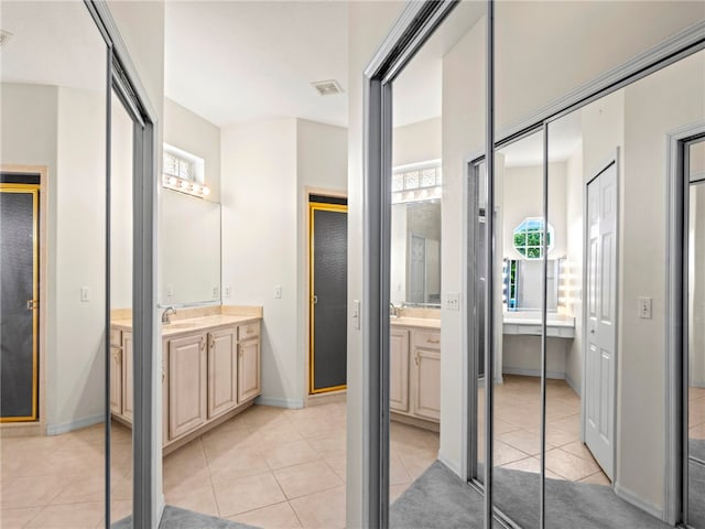 bathroom with vanity and tile patterned flooring